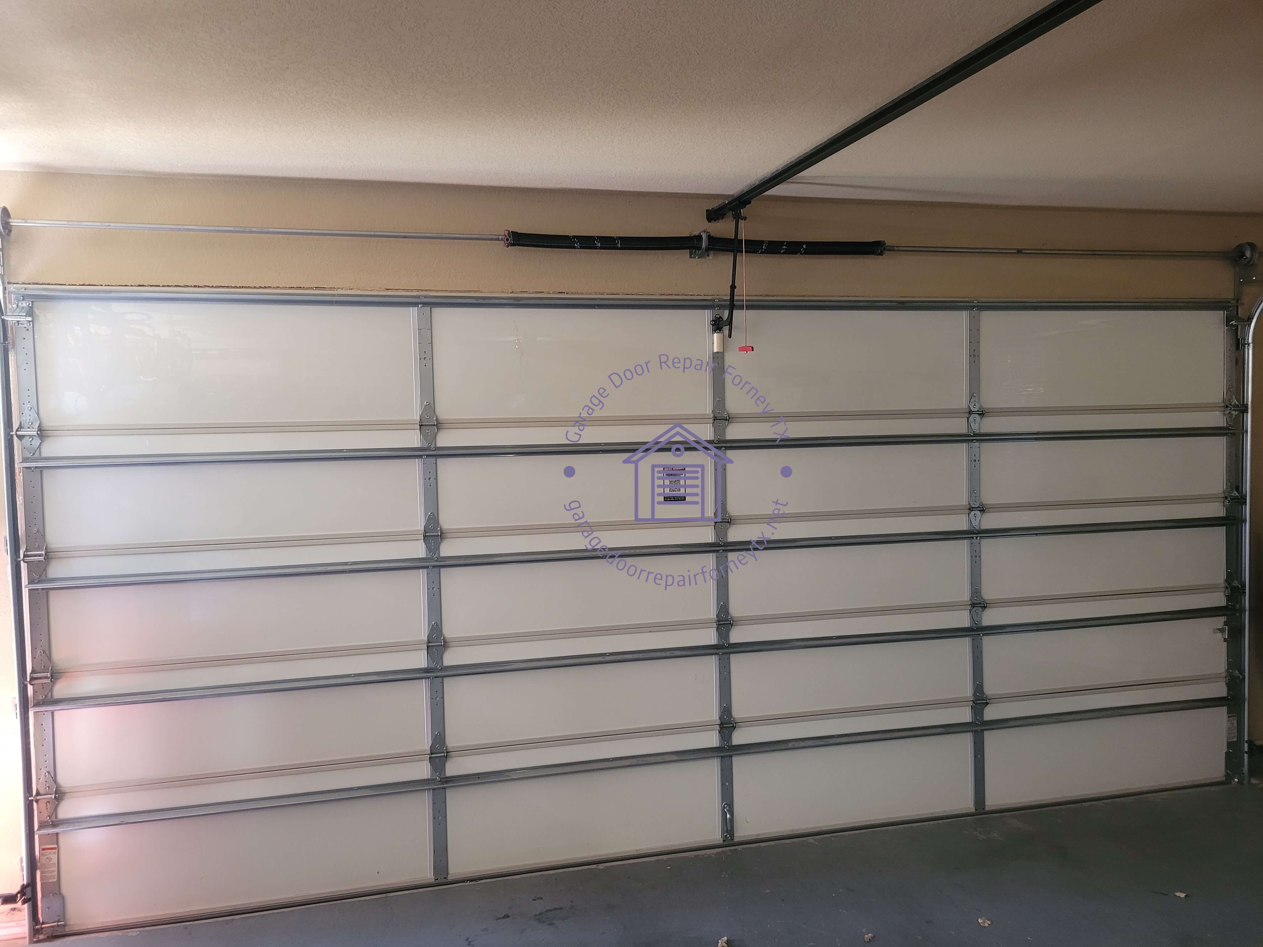 garagedoorrepairforneytx.net_new_torsion_spring_garage_door_install