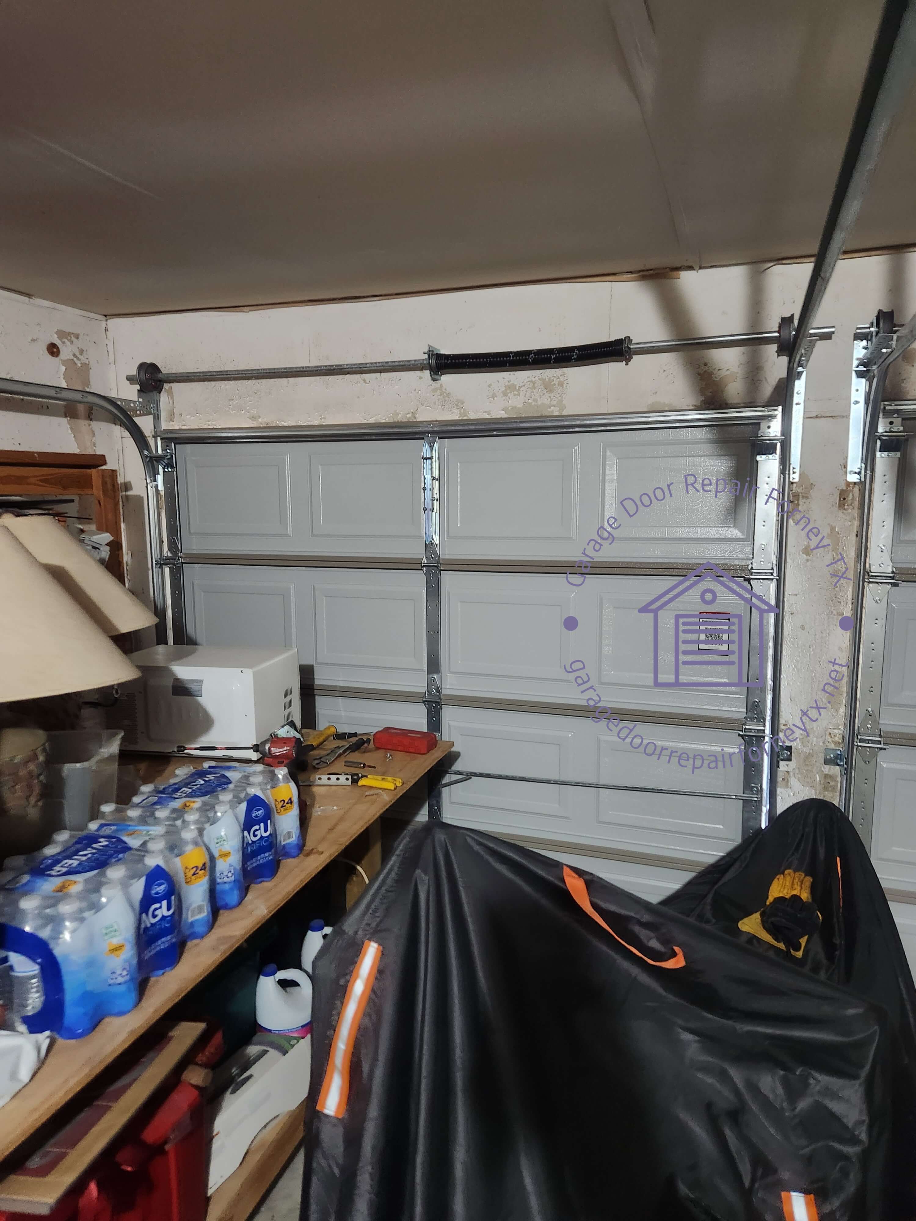 garagedoorrepairforneytx.net_single_torsion_spring_install